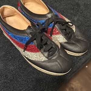 Black Leather Sneakers with Red, Blue, and Gold Glitter Stripes Gucci sneakers.